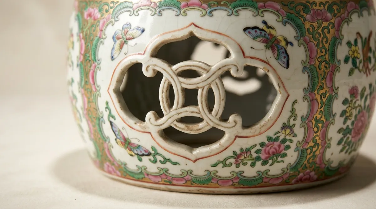 Close-up of a pierced cash-coin motif on a garden stool